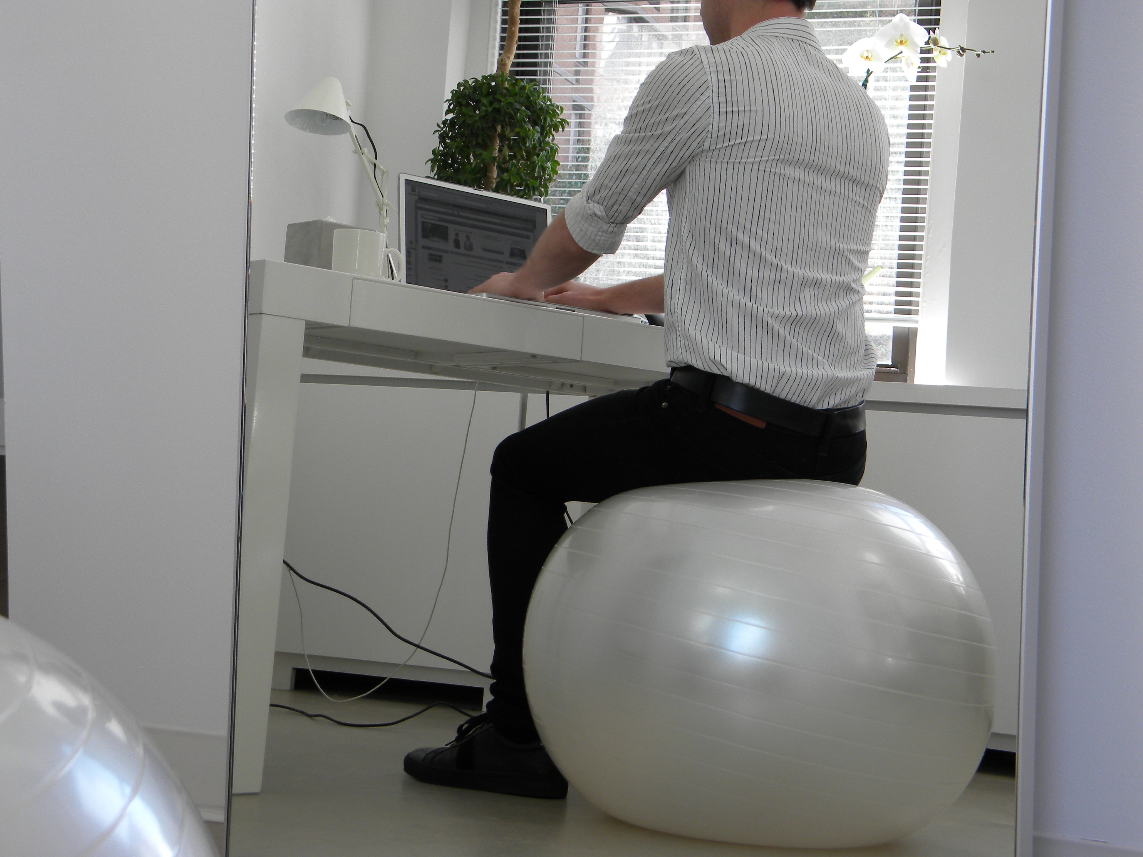 sitting on exercise ball at work